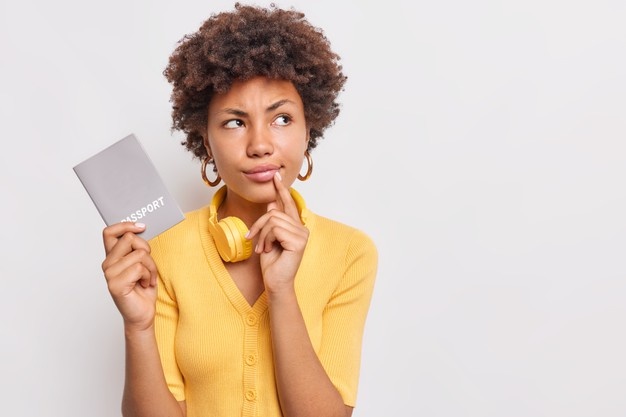 Woman with a passport and a curious expression. SIAS group